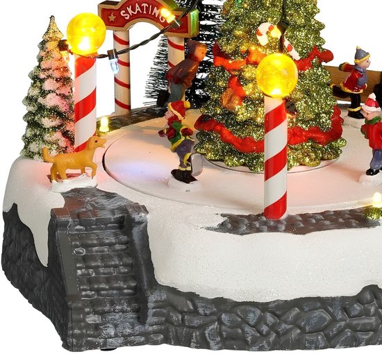 Luville Kerstdorp Kerstboomscène met Schaatsbaan - Kerstversiering met Bewegende Figuren en LED-verlichting - Guirlande op Batterijen - Kerstslingers voor Binnen - 22 x 22 x 18,5 cm - Wit